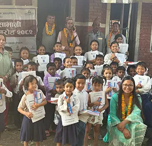 Students in school uniforms with their teachers