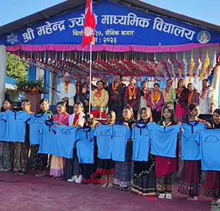 Students holding up new school uniforms